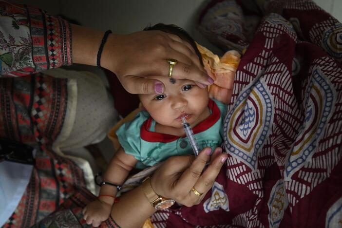 A child gets an oral vaccine in New Delhi, India, on June 17. India has made notable progress in improving access to childhood vaccinations.