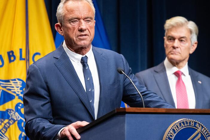 Secretary of Health and Human Services Robert F. Kennedy Jr. addresses reporters on Monday as Medicare and Medicaid Administrator Dr. Mehmet Oz, right, listens.