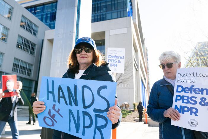 People participate in a rally to call on Congress to protect funding for PBS and NPR outside the NPR headquarters in Washington, DC, on March 26, 2025.