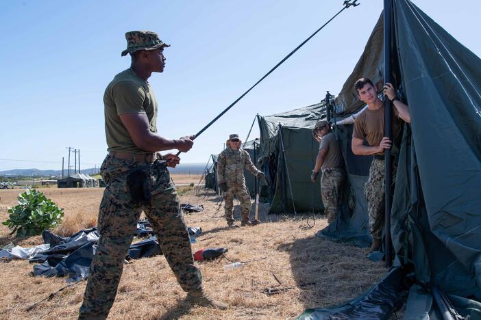 U.S. service members set up tents to house migrants in February 2025, at Naval Station Guantanamo Bay. Several hundred tents were erected; so far none have been used.