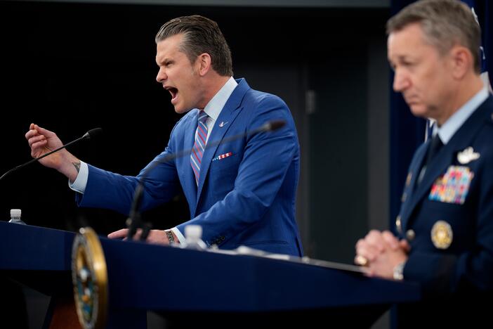 Defense Secretary Pete Hegseth (L), accompanied by Chairman of the Joint Chiefs of Staff Air Force Gen. Dan Caine (R), speaks during a news conference at the Pentagon on Thursday about the U.S. airstrikes against Iran's nuclear facilities.