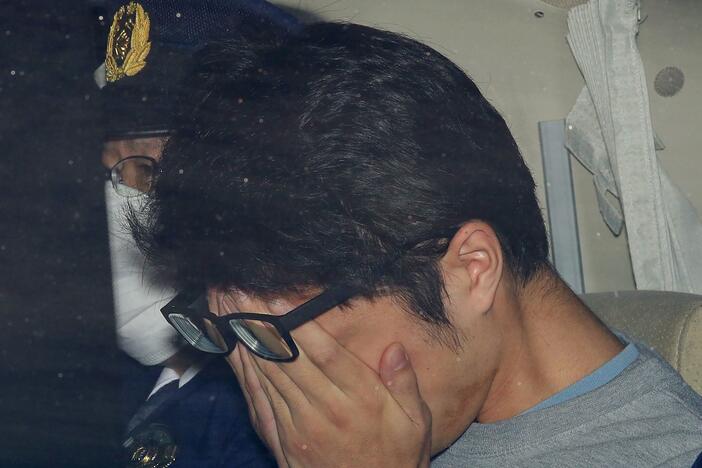 FILE - Takahiro Shiraishi leaves a police station in Hachioji, suburbs of Tokyo, in November 2017.