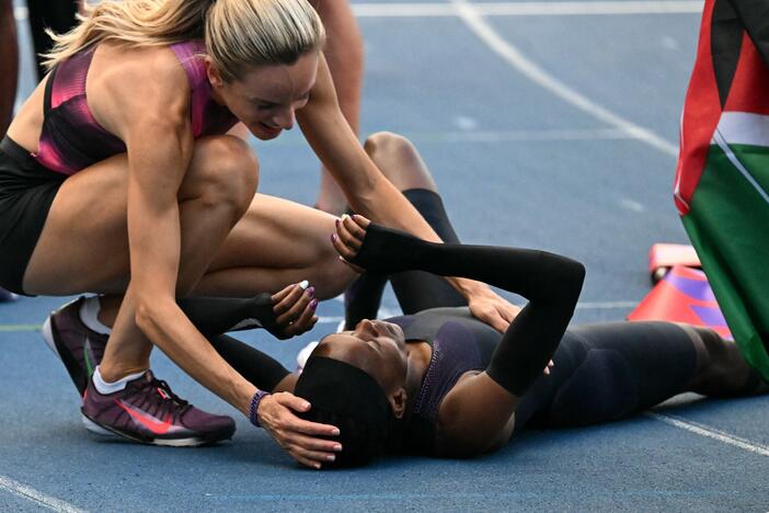 Kenya's Faith Kipyegon reacts at the end of her race after taking part in the "Breaking4" event, in an attempt to become the first woman to run a mile in under four minutes, at Stade Charlety on June 26, 2025 in Paris.
