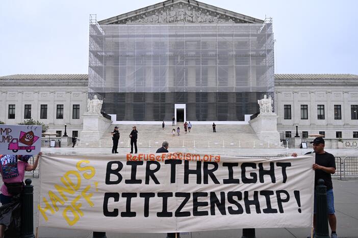 Demonstrators hold a sign reading "Hands Off Birthright Citizenship!" outside the Supreme Court on June 27, 2025. The Supreme Court did not rule on President Trump's controversial executive order, but it did limit lower courts' ability to block executive actions with universal injunctions.