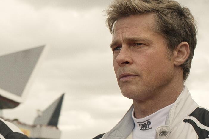 Damson Idris as Joshua Pearce and Brad Pitt as Sonny Hayes in <em>F1</em>.