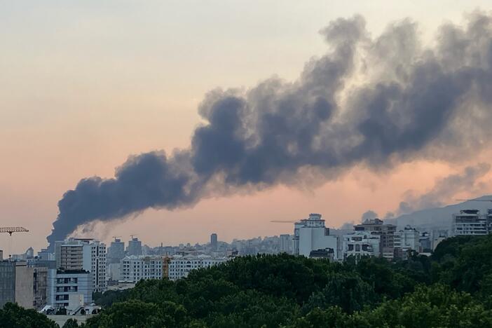 Smoke billows from an explosion at the Islamic Republic of Iran Broadcasting (IRIB) building in Tehran after an Israeli strike hit the building, cutting off live coverage, on June 16.