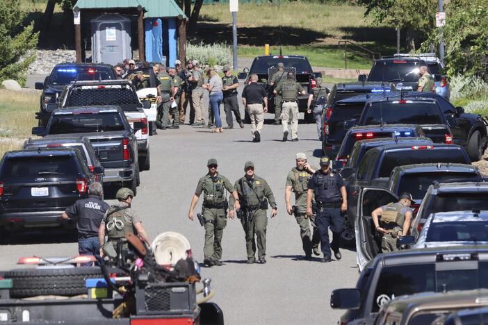 Law enforcement and emergency responders are shown on Sunday afternoon following reports of an ambush shooting attack on Canfield Mountain, in Coeur d'Alene, Idaho.