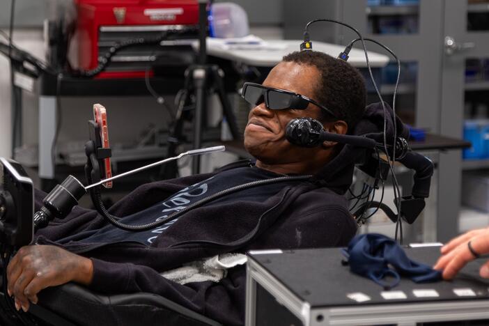 Phillip McKenzie, who was paralyzed from the neck down in a fall in 2012, uses a brain-computer interface developed by researchers at the University of Pittsburgh to navigate complex virtual tasks that simulate everyday activities,