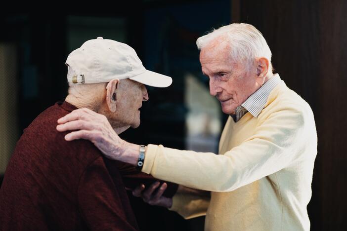 Andrew Roth (left) stands up from his wheelchair to give Jack Moran a hug at the Shoah Foundation at the University of Southern California in Los Angeles. Roth was imprisoned in the Buchenwald concentration camp, which Moran helped liberate while serving in the U.S. Army.<br><br><br><br>