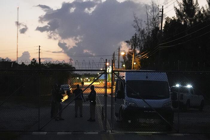 Krome Detention Center officers man a gate leading to the U.S. Immigration and Customs Enforcement facility, May 24, 2025, in Miami.