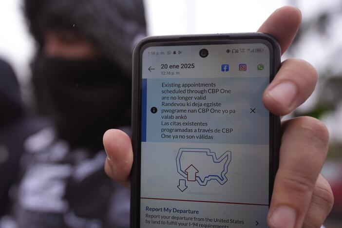 A migrant seeking asylum holds up the CBP One app showing his appointment was canceled after President Donald Trump was sworn into office, Jan. 20, 2025, in Matamoros, Mexico. A federal judge Wednesday struck down Trump's suspension of asylums at the southern border.