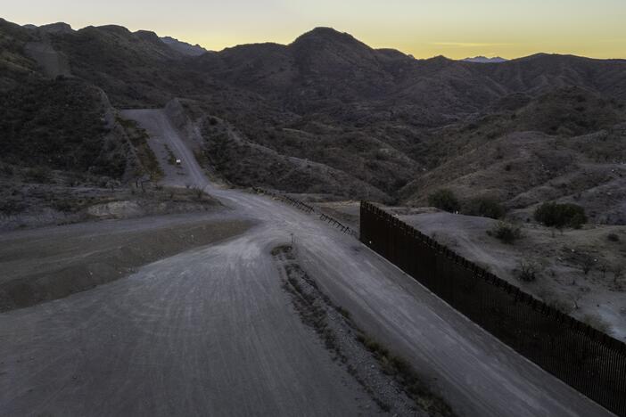 From an aerial view, the U.S.-Mexico border fence ends with a gap on Jan. 20, 2025 near Sasabe, Ariz. Republicans' tax and spending bill includes $46.5 billion for border wall projects.