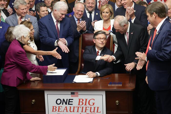 House Speaker Mike Johnson, R-La., celebrates with fellow House Republicans during an enrollment ceremony following final passage on Thursday.