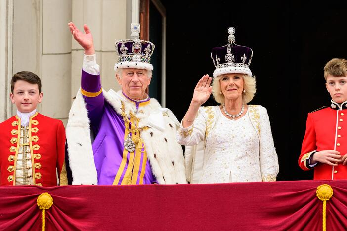 King Charles III and Queen Camilla wave from the balcony of Buckingham Palace during the Coronation of King Charles IIII and Queen Camilla on May 06, 2023 in London, England.