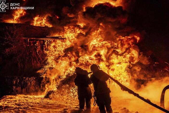 In this photo provided by the Ukrainian Emergency Service, emergency services personnel work to extinguish a fire following a Russian attack in Kharkiv region, Ukraine, Saturday, July 5, 2025.