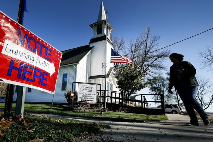 A local resident leaves a church after voting in an election in Cumming, Iowa.