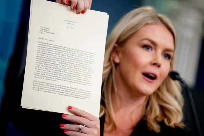 White House press secretary Karoline Leavitt holds up a copy of a letter to Japan, signed by President Trump, announcing 25% tariffs beginning on Aug. 1st, during the daily press briefing at the White House on July 7.