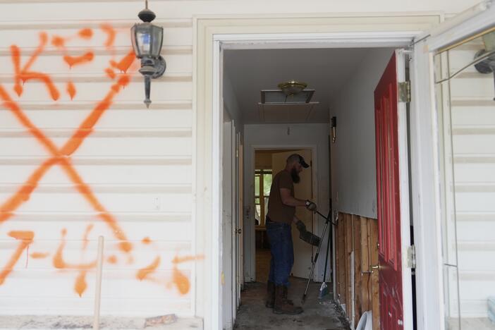 Volunteers clean up a house after flooding in Kerrville, Texas. The state's governor and top emergency official are on a board considering options to eliminate the Federal Emergency Management Agency, at the request of President Trump.