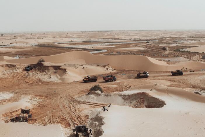 This aerial view show trucks loading sand from a quarry on the outskirts of Nouakchott, Mauritania, on March 14, 2023.