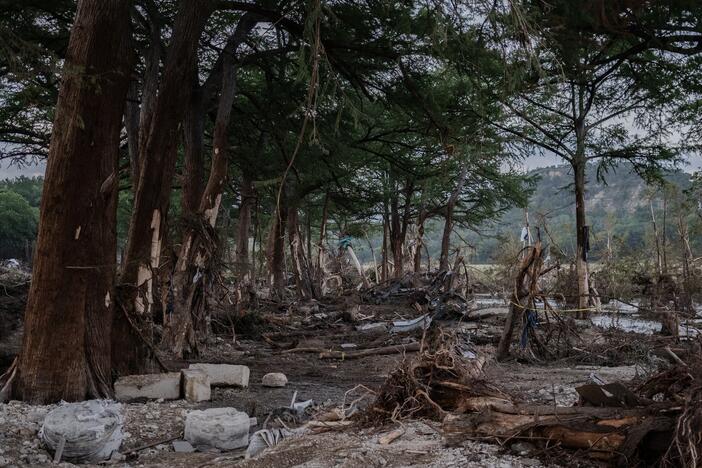 Debris lays along the Guadalupe River on Tuesday after it was swept up in the flash flooding in Ingram, Texas. More than 100 fatalities were reported after heavy rainfall caused flooding along the river in central Texas.