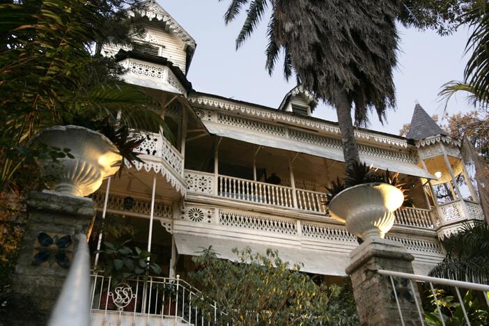 Main entry to the Hotel Oloffson, built as a private residence by Simon Sam in about 1886. American Marines leased it and turned it into a military hospital in the early 20th century. In 1936 Walter Oloffson converted it to a hotel. In the 1950s through 1970s it was a Hollywood jetset destination.