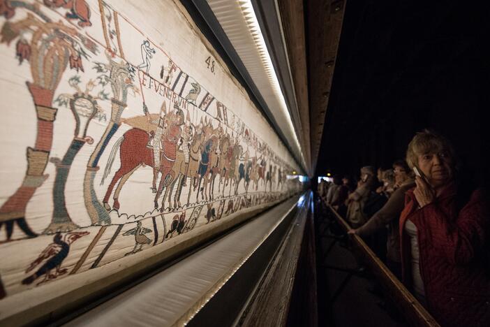 People look at the Bayeux tapestry in Bayeux, western France, on Sept. 13, 2019.