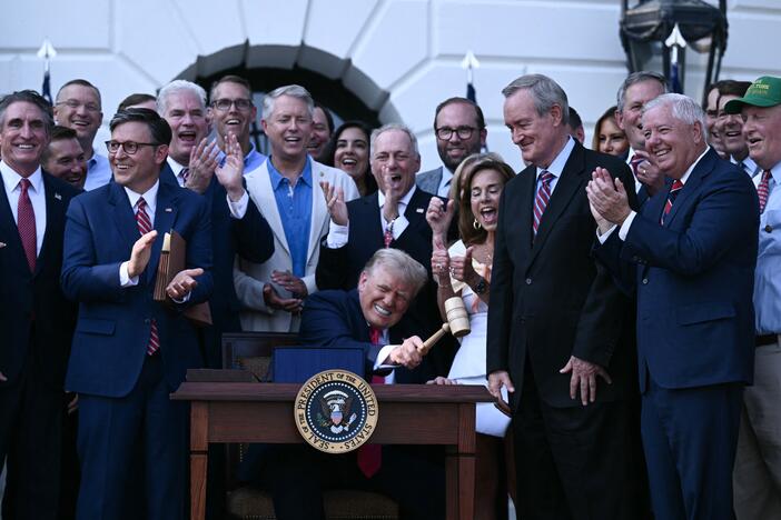 President Trump bangs a gavel after signing the One Big Beautiful Bill Act at the White House on July 4.