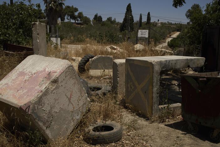 Concrete blocks placed by Israeli soldiers after October 7, 2023, according to local residents, are seen at one of the entrances to the West Bank village of Sinjil, impeding access for Palestinians, on July 9, 2025.