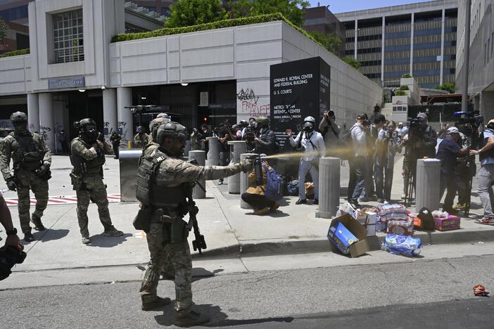 Federal agents and National Guard troops confront protesters outside the downtown Los Angeles federal building on June 8, 2025. In a lawsuit challenging the Trump administration's immigration crackdown in Los Angeles, the ACLU alleged that people at the facility have been held in deplorable conditions and denied access to lawyers.