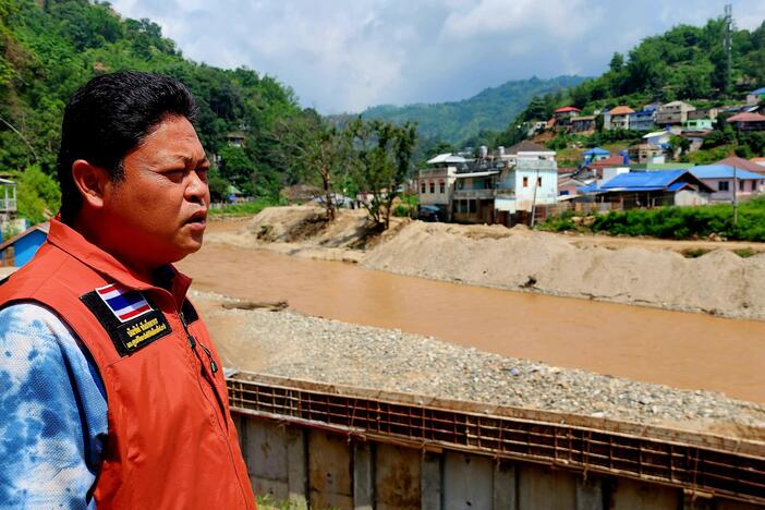 Bundit Pantarakon, a local businessman and city council member in Mae Sai, Thailand, looks over the Sai River.