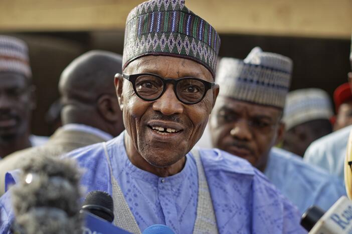 Nigeria's President Muhammadu Buhari speaks to the media after casting his vote in his hometown of Daura, in northern Nigeria, Saturday, Feb. 23, 2019. (AP Photo/Ben Curtis, File)