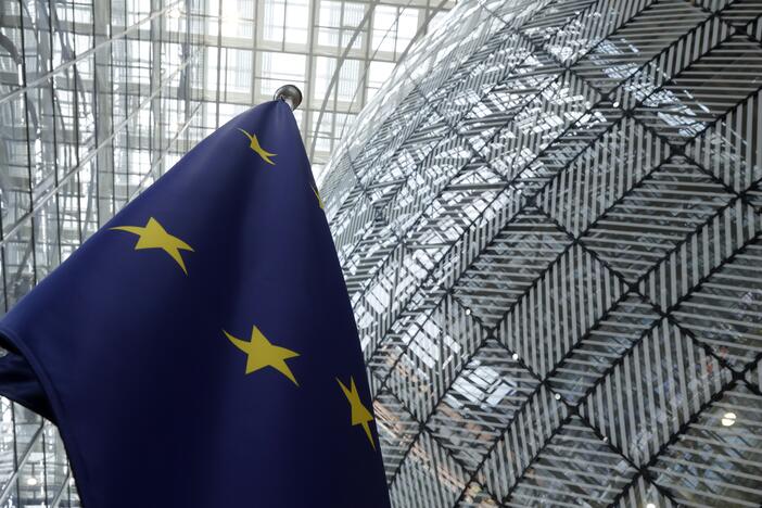 The European Union flag stands inside the atrium at the European Council building in Brussels, June 17, 2024.