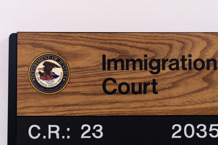 In this file photo, a sign shows the location of an immigration court in New York City. In July, 16 more immigration judges were fired.