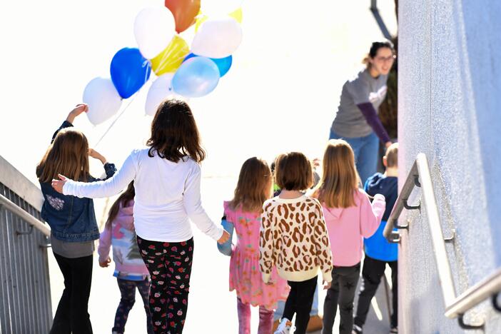 A teacher gives a tour of Nora Sterry Elementary School to students in Los Angeles in January. California is one of 24 states suing the Trump administration over frozen education grant funding.