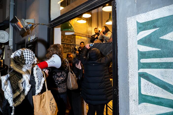 Protesters enter Miznon Hardware Lane in Melbourne, Australia, July 4. Demonstrators clashed with staff at the restaurant, which is co-owned by Shahar Segal, who had joined the Israeli- and U.S.-backed Gaza Humanitarian Foundation as a spokesperson. Segal has since left his role with the controversial Gaza food distribution group.