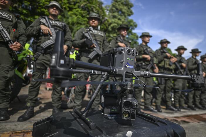 Police officers stand in formation behind a drone that will be used to increase the security in Jamundi, Valle del Cauca province, Colombia, on June 13, 2024.