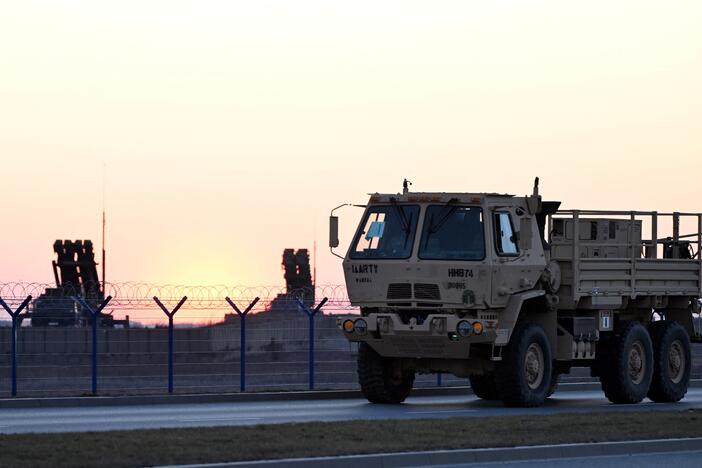 A military vehicle drives by Patriot air defense systems installed at the Rzeszow-Jasionka airport, a logistics hub for U.S. and European military aid to Ukraine, in southeastern Poland on March 6.