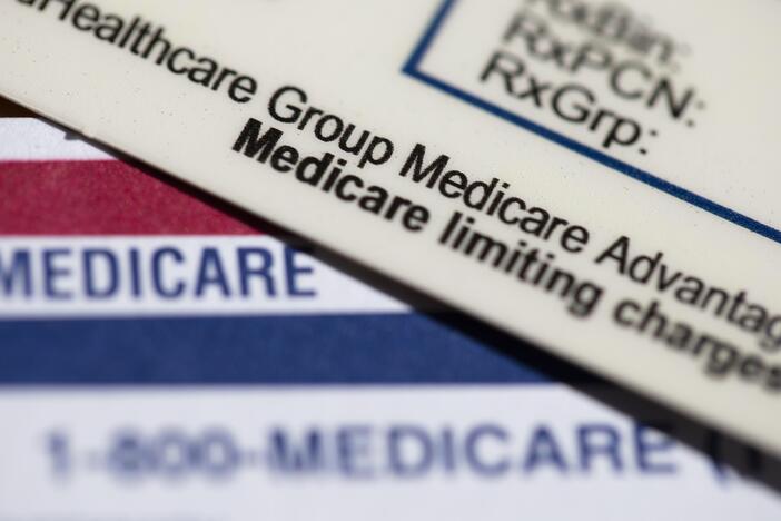 Medical plan cards are seen in Portland, Ore. A federal judge this past week overturned a Consumer Financial Protection Bureau rule that would have removed medical bills from credit reports and prevented lenders from making decisions based on that medical information.