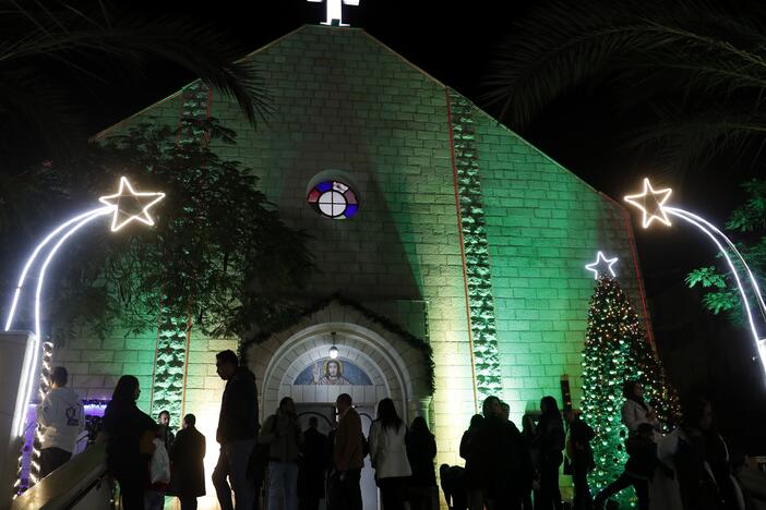 Palestinian Christians wait to pray at the midnight Christmas Eve Mass out side the Deir Al Latin Holy Family Catholic Church in Gaza City, 2021.
