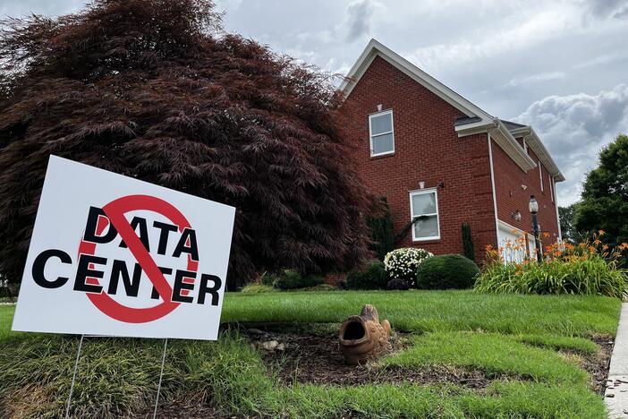 The yard of a house in Chesapeake, Va., displays a sign opposing the construction of data centers.