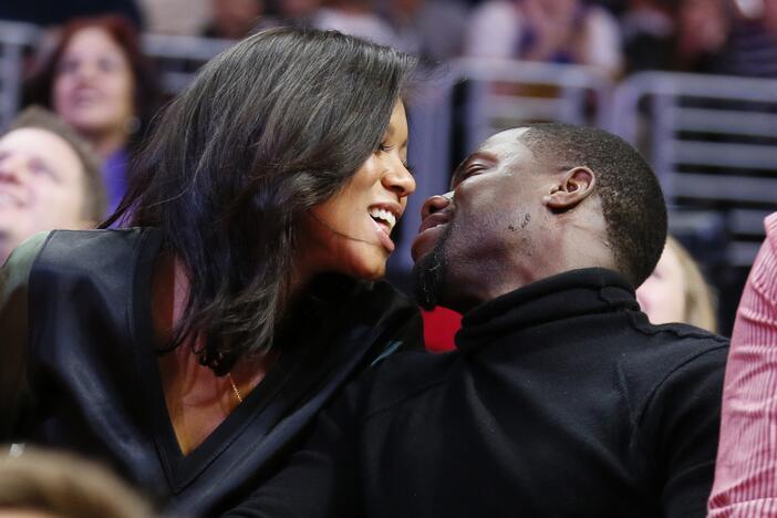 Kiss cams often capture moments of delight, such as this 2014 smooch between comedian Kevin Hart and fiancee Eniko Parrish at an NBA basketball game between the Golden State Warriors and Los Angeles Clippers in Los Angeles. But as this week's incident involving a tech CEO and his human resources head shows, kiss cam footage can cause trouble.