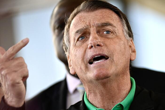 Former Brazilian President Jair Bolsonaro speaks to the press at the Federal Senate in Brasilia on July 17, 2025.