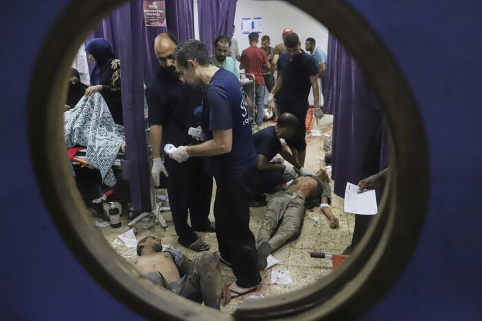 Palestinians who were injured during a food distribution at a center run by the Gaza Humanitarian Foundation, a U.S.-backed organization approved by Israel, receive treatment on the floor of Nasser Hospital in Khan Younis, southern Gaza Strip, Saturday, July 19, 2025.