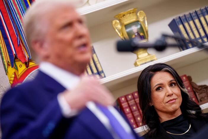 President Trump, accompanied by Tulsi Gabbard, speaks after Gabbard is sworn in as director of national intelligence on February 12.