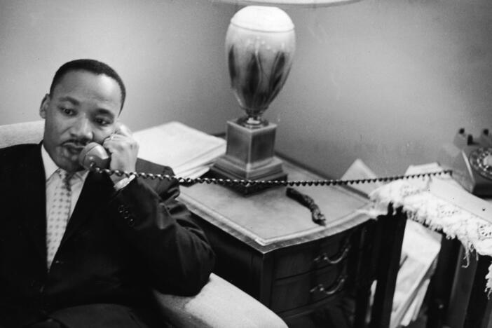 Dr. Martin Luther King, Jr. sits speaks on the telephone after encountering a white mob protesting against the Freedom Riders in Montgomery, Alabama, May 26, 1961. On Monday, the Trump administration released a trove of records about King's assassination.
