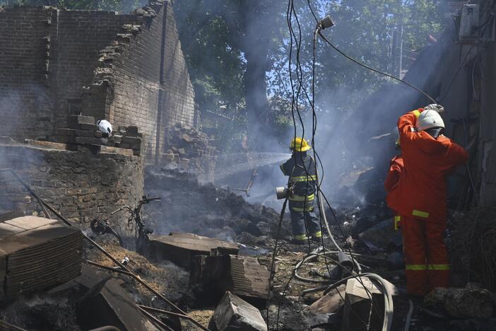 Emergency services personnel work to extinguish a fire following a Russian attack in Odesa, Ukraine, on July 11.