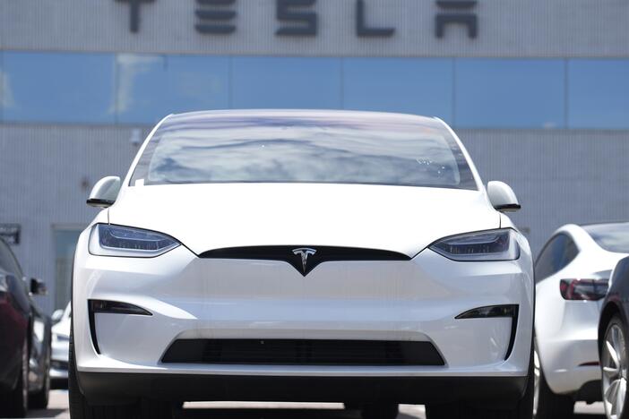 A 2023 Model X sports-utility vehicle sits outside a Tesla dealership Sunday, June 18, 2023, in Englewood, Colo.