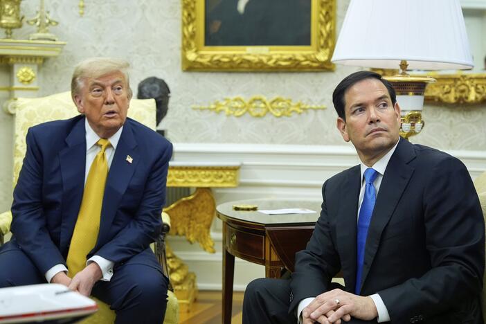 President Trump and Secretary of State Marco Rubio listen during an Oval Office meeting at the White House on July 16.