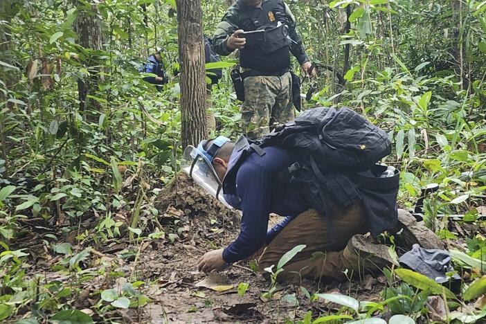 In this July, 2025, photo released by the Royal Thai Army, Thai soldiers inspect a border area in Ubon Ratchathani† province where the Royal Thai Army said two anti-personnel landmines were found.