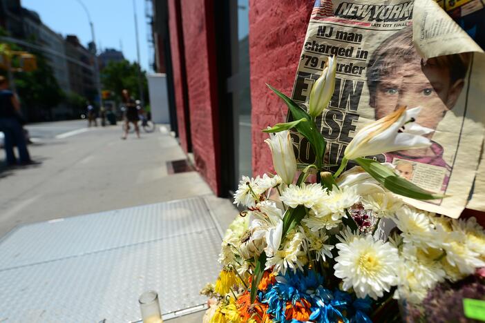 People walk past a street shrine to Etan Patz in 2012.